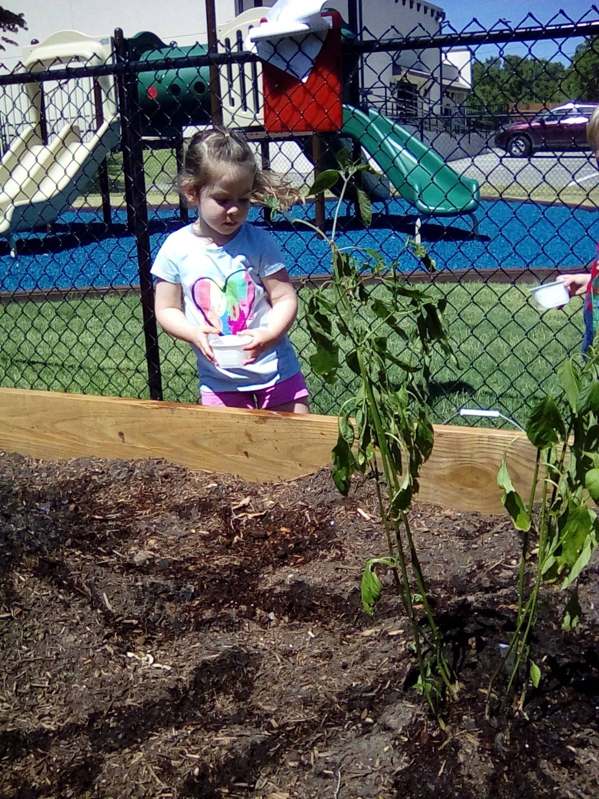 Child gardening outside